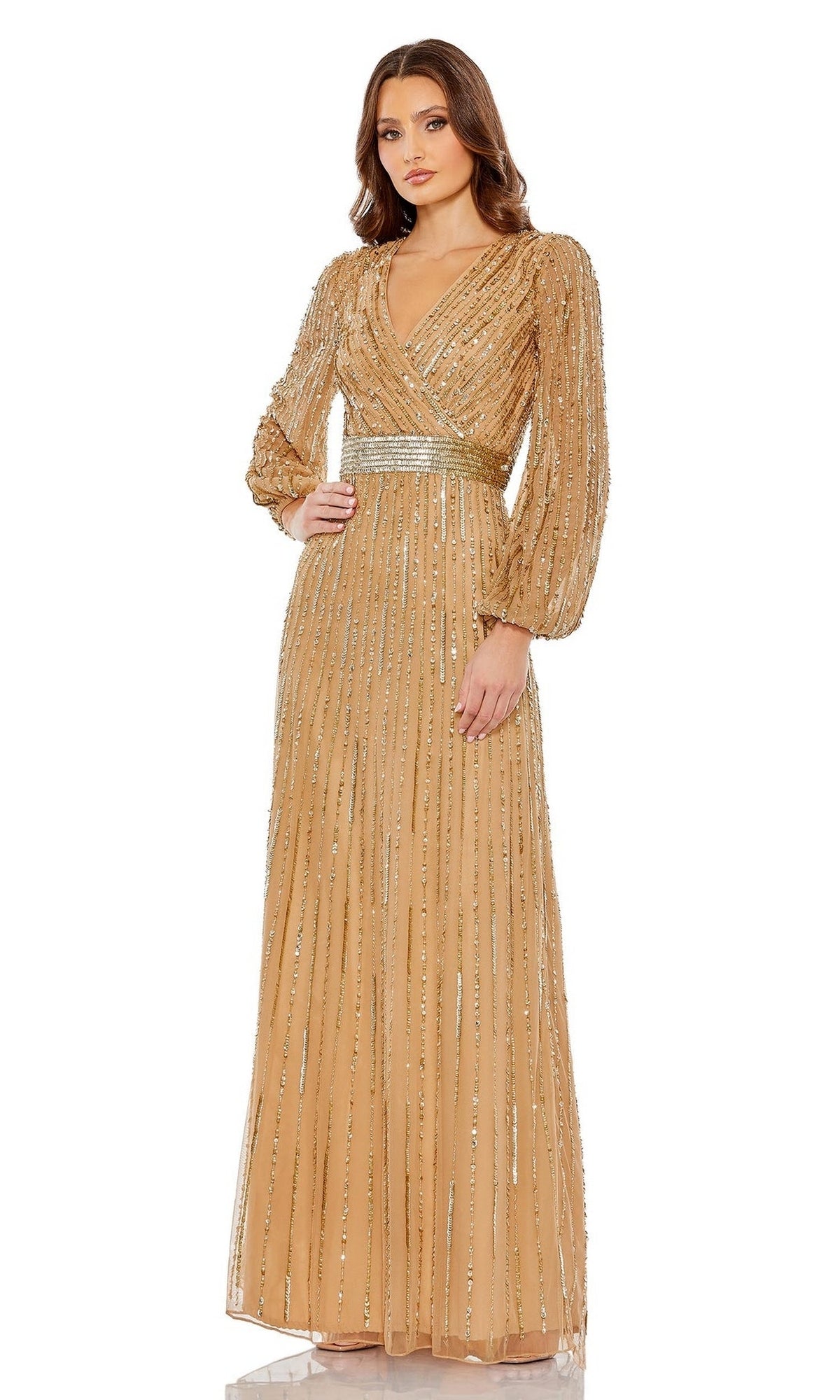 A woman models the Long Formal Dress 5718 by Mac Duggal—featuring a floor-length silhouette, beaded waist, long sleeves, and V-neckline—posed against a white background.